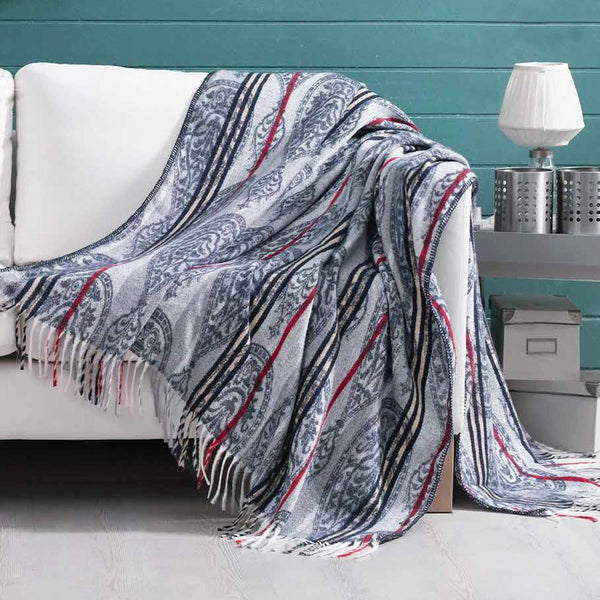 Blue and red paisley pattern and striped 150cm x 200cm blanket draped over a sofa arm