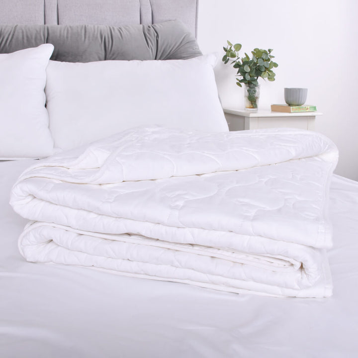 Close-up of 6 tog pure cotton duvet with a detailed pattern for a luxurious ad breathable sleep
