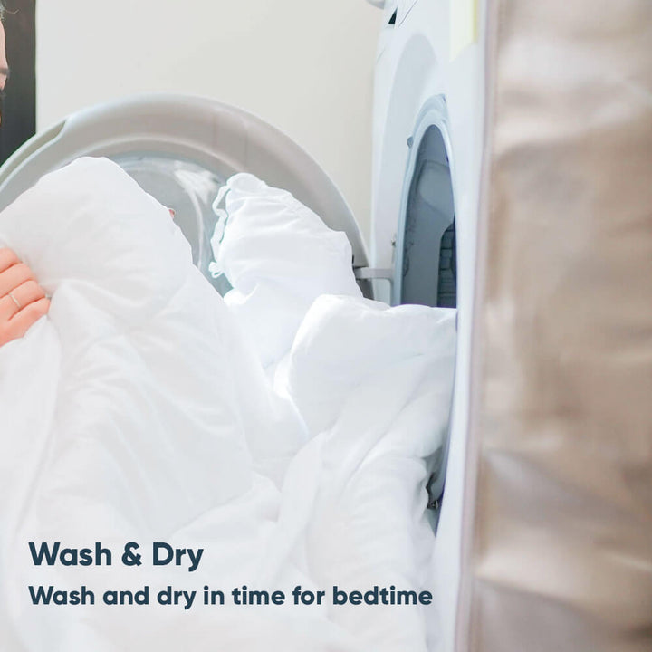 The dual tog duvet being placed into a washing machine for washing