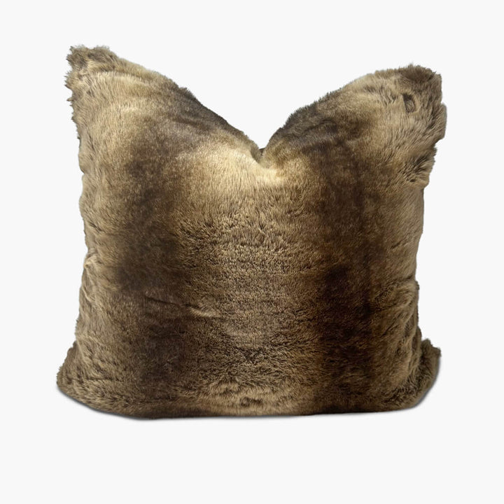 Front view of 60cm Alaskan fur cushion filled with a duck feather inner. The cushion shows a karate chop and is isolated on a white background