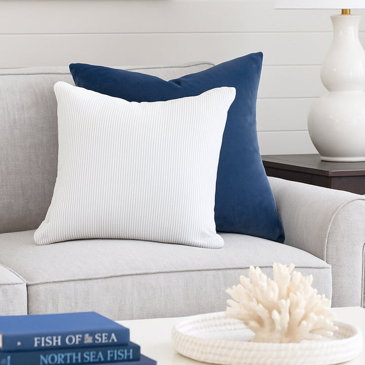 45cm x 45cm light blue and white striped scatter cushion on a sofa