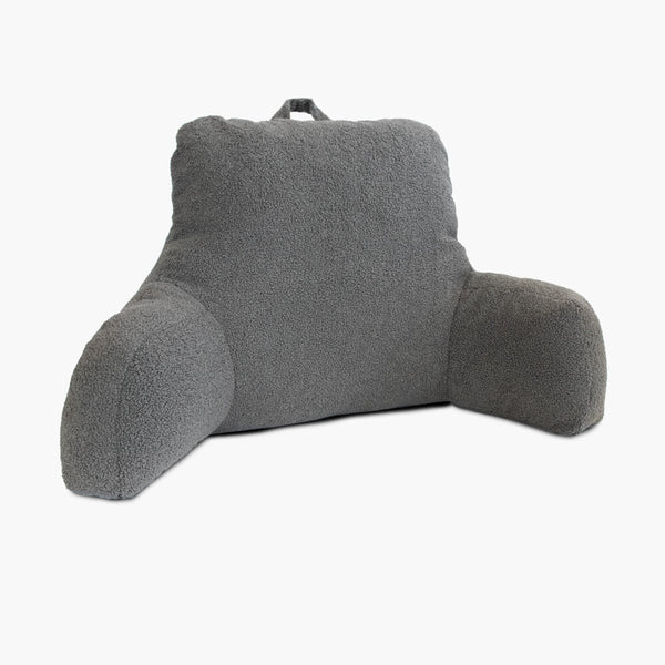 Charcoal grey teddy fleece reading cushion with handle, isolated on a white background
