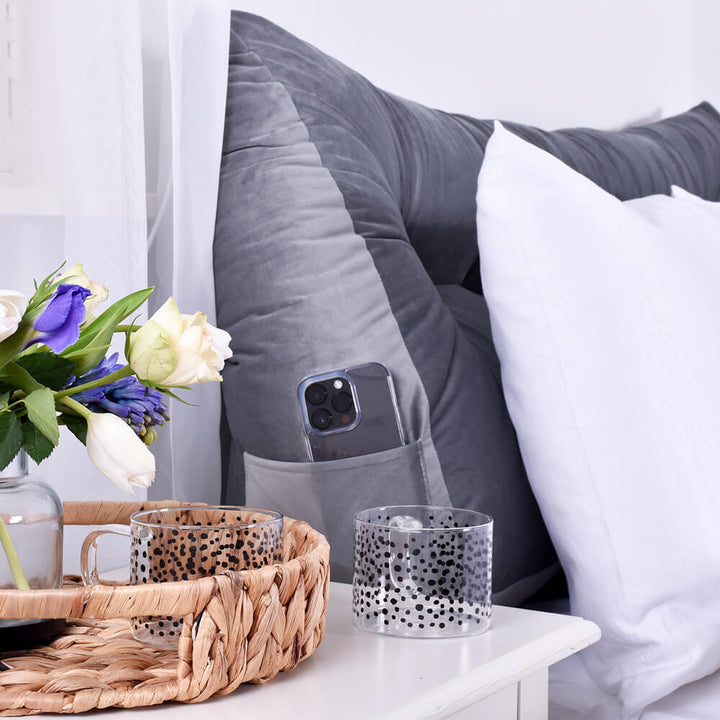 Grey Velvet Headboard Wedge with a phone in the side pocket 