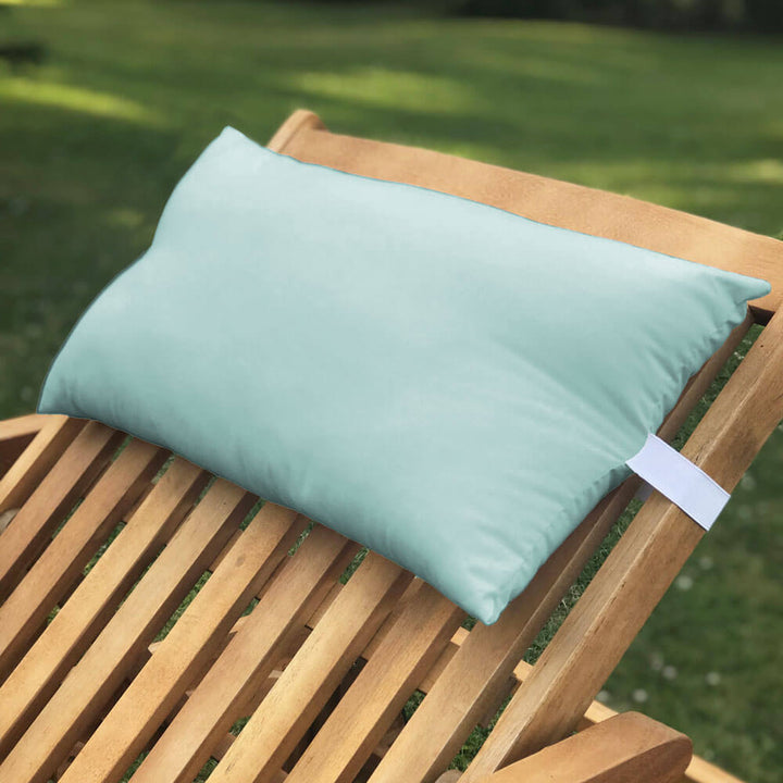 Lancashire Textiles mint green Sun Lounger Pillow secured to a wooden sun lounger with elasticated strap