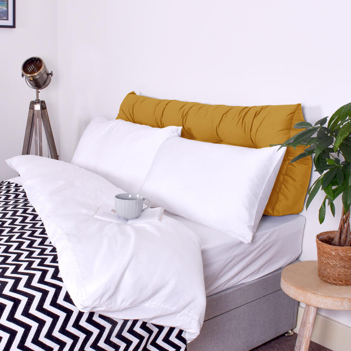 Mustard Velvet Headboard Wedge Pillow on bed