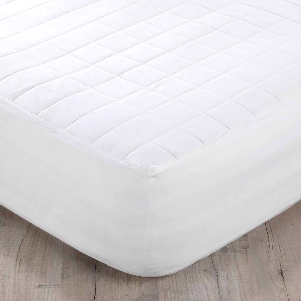 Close-up of pure cotton mattress protector showing soft, breathable, and durable fabric for mattress protection and hygiene