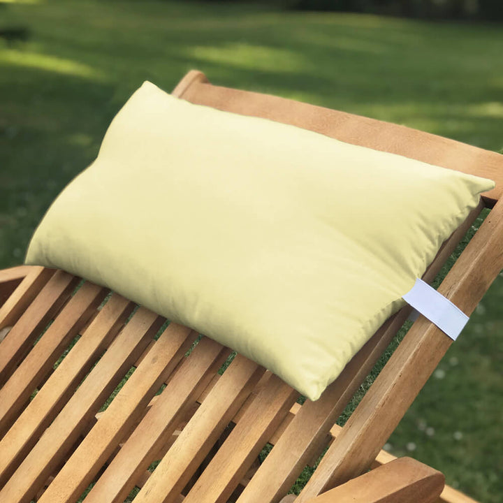 Lancashire Textiles lemon yellow Sun Lounger Pillow secured to a wooden sun lounger with elasticated strap
